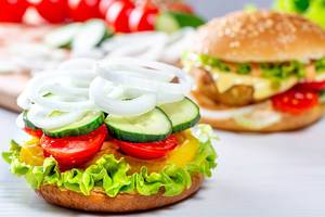 Cooking hamburgers with vegetables at home