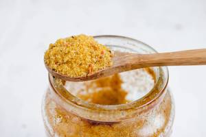 Cooking spice in wooden spoon