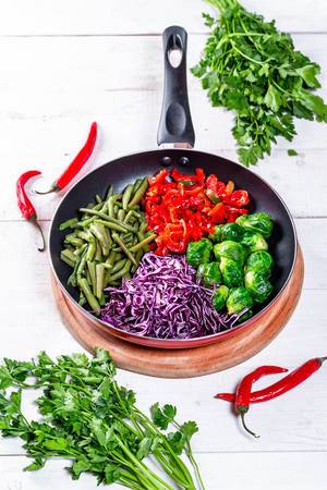 Cooking with fresh vegetables and herbs