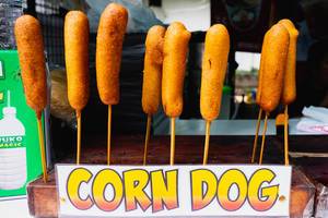 Corn dogs on display at a local food cart