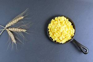 Corn flakes and wheat ear at breakfast, dark background (Flip 2019)