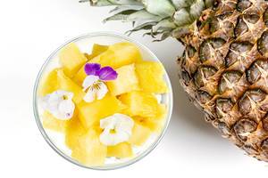 Cottage cheese with fresh pineapple, Chia seeds and edible flowers