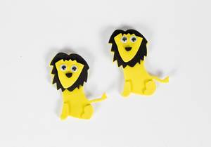 Couple of lion toys isolated on white