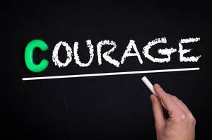 Courage text on blackboard