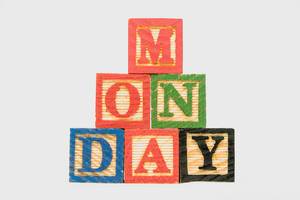 Creative Monday text formed by wooden blocks