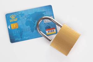 Credit card and padlock on white background
