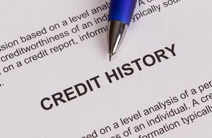 Credit history document with pencil