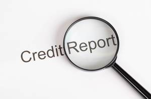 Credit Report text with magnifying glass