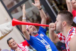 Croatian soccer fan celebrates with a loud vuvuzela
