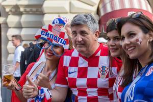 Croatian soccer fans posing for photos