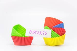 Cupcake liners with a note reading CUPCAKES