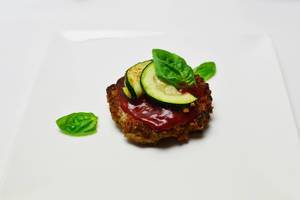 Cutlet with tomato sauce and zucchini
