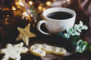 Decorated sugar cookies with a cup of coffee
