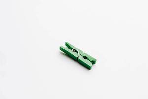Decorative green wooden clip on white background