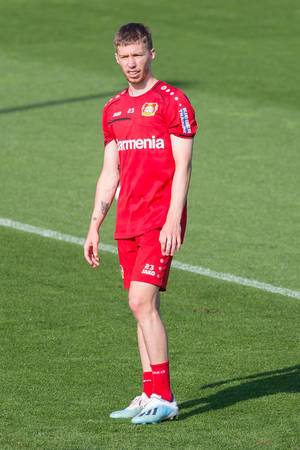 Defender Mitchell Weiser stands alone on the grass during football training