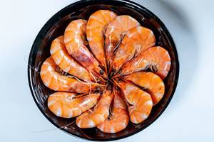 Delicious shrimp in a black plate  Flip 2019