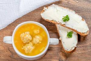 Delicious soup with potatoes and chicken meatballs in tureen and cheese sandwiches (Flip 2019)