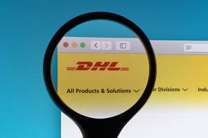 DHL logo under magnifying glass