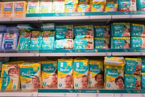 Diapers selection in a store with Pampers covering the space