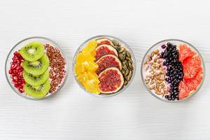 Different Breakfast options with oatmeal, fresh fruit and seeds. Top view (Flip 2019)