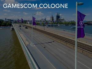 Direction to Gamescom in Cologne is accompanied by flags of the games fair, with the cathedral in the background
