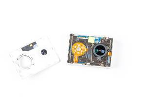 Disassembled action camera on a white background (Flip 2020)