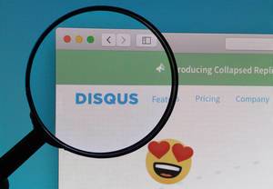 Disqus logo under magnifying glass