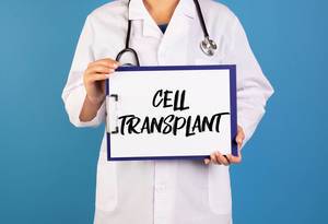 Doctor holding clipboard with Cell transplant text
