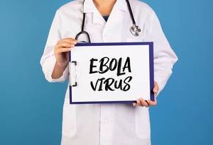 Doctor holding clipboard with Ebola virus text