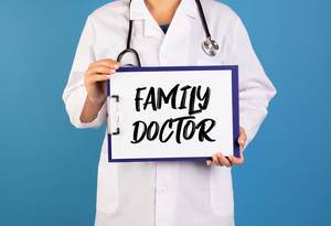 Doctor holding clipboard with Family doctor text