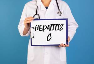 Doctor holding clipboard with Hepatitis C text