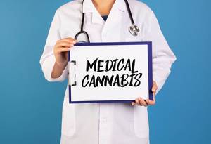 Doctor holding clipboard with Medical Cannabis text