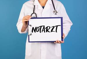 Doctor holding clipboard with Notarzt text