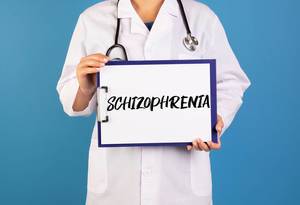 Doctor holding clipboard with Schizophrenia text