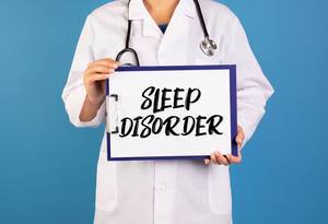 Doctor holding clipboard with Sleep disorder text