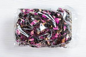 Dried Crimean black tea with pink flower petals in a package (Flip 2019)