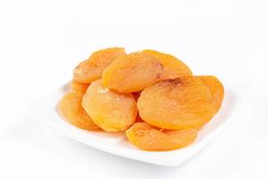 Dried Peaches on the white plate (Flip 2019)