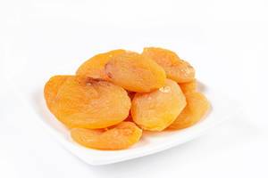 Dried Peaches on the white plate