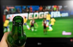 Drinking beer and wathing football on TV.jpg