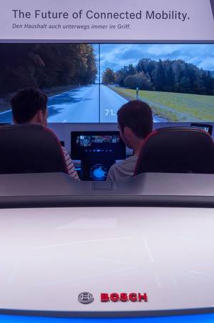 Driving simulator with cockpit and huge display made by Bosch