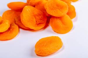 Dry apricots fruit on white background close up (Flip 2019)