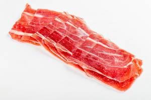 Dry-cured ham slices on white (Flip 2019)