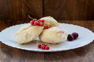 Dumplings with berry filling on white dish
