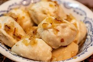 Dumplings with potatoes in plate