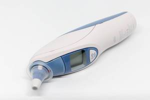 Ear thermometer on white background