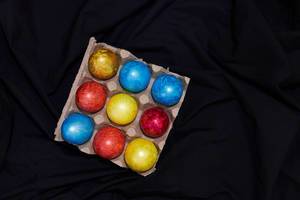 Easter concept. Painted easter festive eggs on the dark textile.jpg