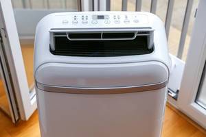 Eco-friendly and mobile air conditioner and dehumidifier with open ventilation, timer and sleepmodus by Comfee