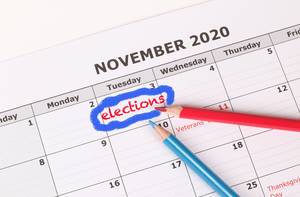 Elections reminder in calendar with red and blue pen.jpg