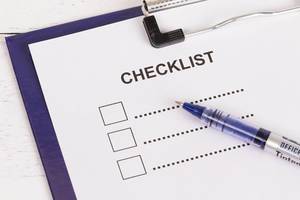 Empty checklist with pencil on clipboard