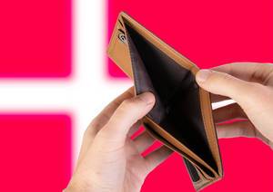 Empty Wallet with Flag of Denmark. Recession and Financial Crisis to come with more debt and federal budget deficit?